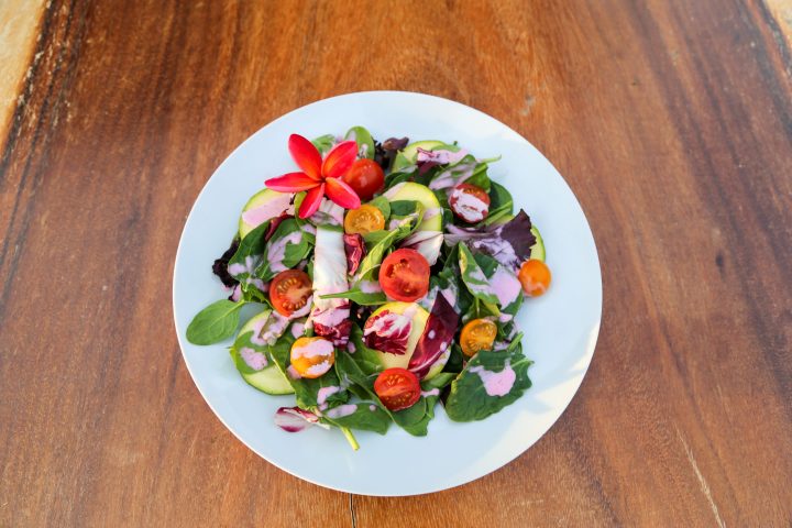 a plate of food on a wooden table